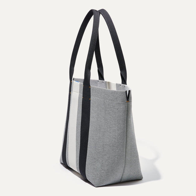 The Essential Tote in Grey Mist shown in diagonal view..