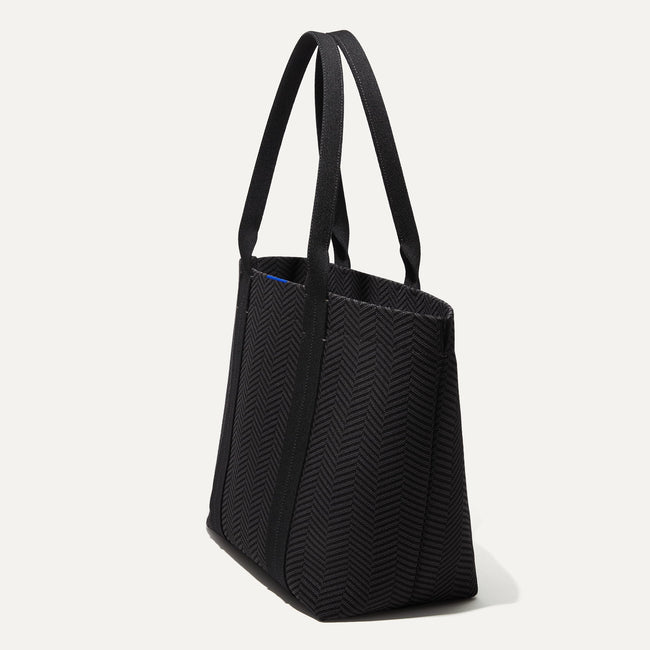 The Essential Tote in Shadow Black shown in diagonal view. 
