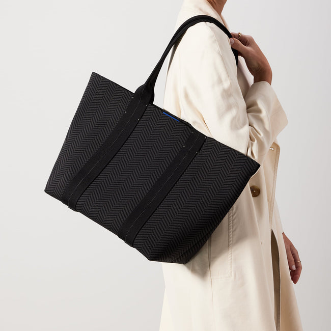 hover | The Essential Tote in Shadow Black worn by a model. 