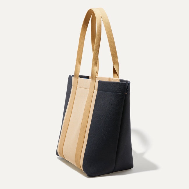 The Essential Tote in Ink and Ivory shown in diagonal view.