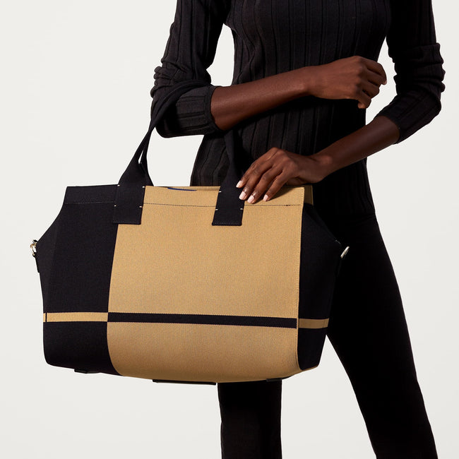The Overnighter in Camel and Black shown on model.
