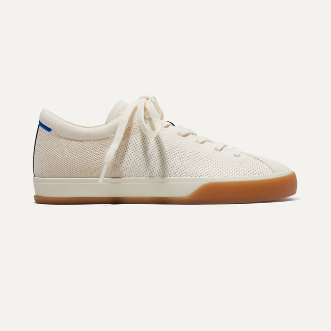 The Lace Up Sneaker in Blonde shown from the side. 