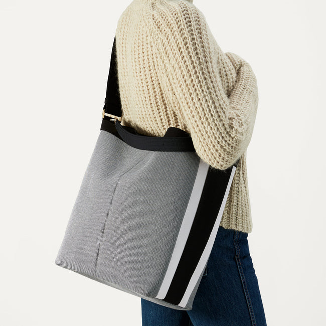 hover | The Bucket Bag in Grey Mist shown on model.
