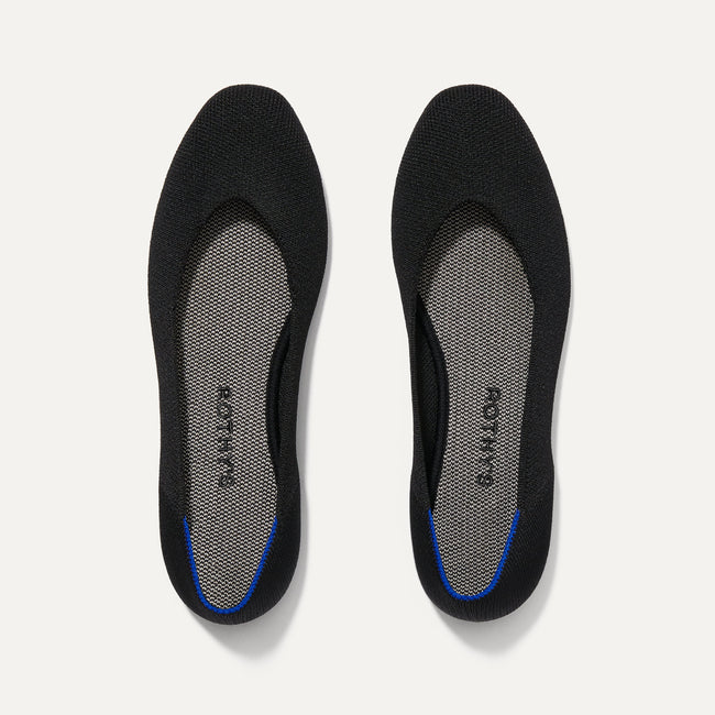 A pair of The Square toe flat shoe in Black shown from the top view.