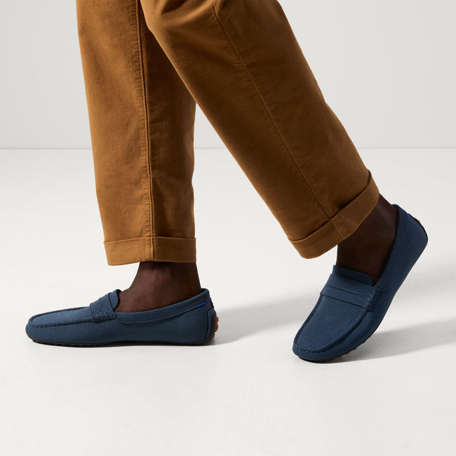 Model wearing The Driving Loafer in Navy. 