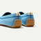  Close up of the heel of The Driving Loafer in Sky, with raised nub outsoles and Rothy's signature blue halo. 