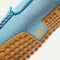 Close up of the outsoles of The Driving Loafer in Sky, with raised nub details and the Rothy's signet on the base of the shoe. 