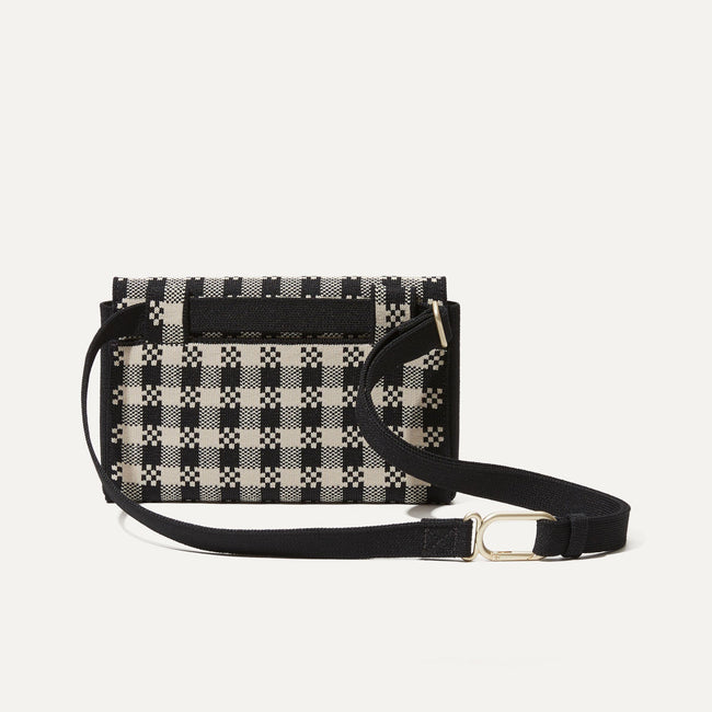 The Belt Bag in Black and Canvas Gingham shown from the back. 