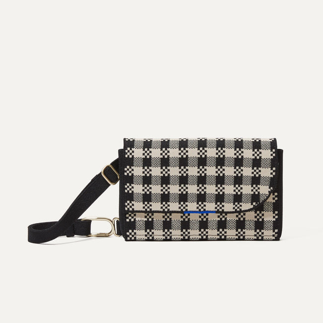 The Belt Bag in Black and Canvas Gingham shown from the front.