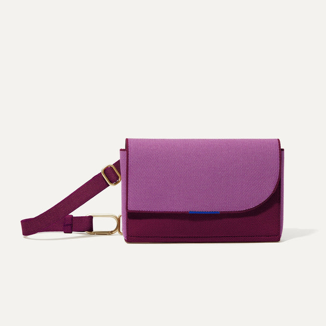 The Belt Bag in Plum Berry shown from the front.