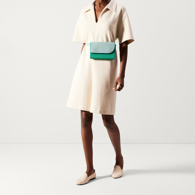 Another view of model wearing The Belt Bag in Sea Green.