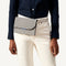 hover | Model wearing The Hemp Belt Bag in Black & Beige.
