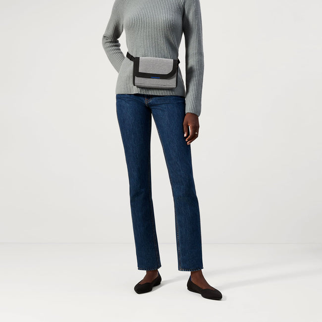 Another view of model wearing The Belt Bag in Grey Mist.