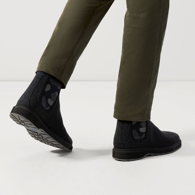 Model wearing The Merino Chelsea Boot in Granite Black.
