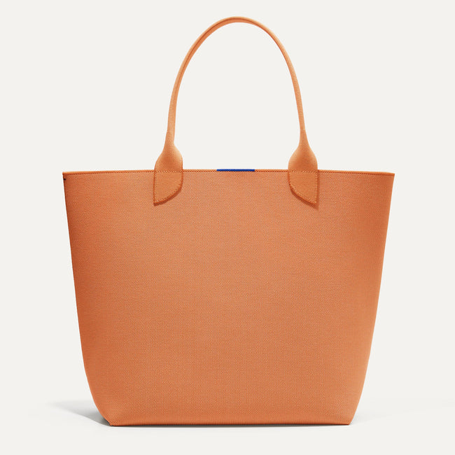 The Lightweight Tote in Clementine shown from the front.