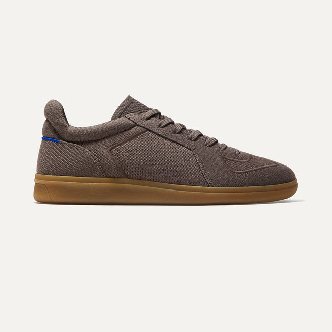 A pair of The Merino RS01 Sneaker in Timber Brown shown from the side.
