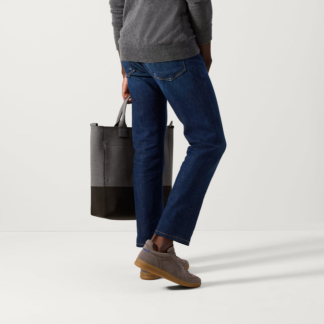 Alternate view of a model wearing The Merino RS01 Sneaker in Timber Brown. 