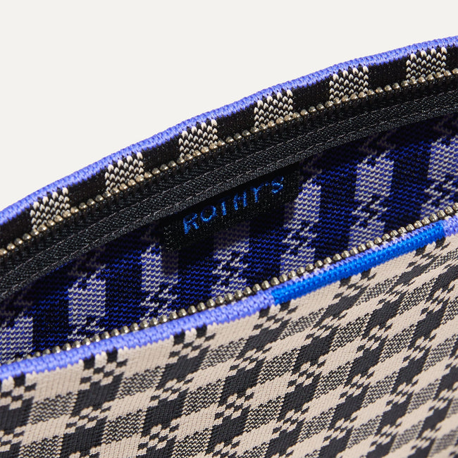 The Wristlet in Black & Canvas Gingham interior view with Rothy's halo detail.