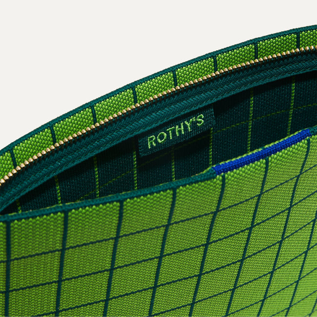 The Wristlet in Leaf Green Windowpane interior view with Rothy's halo detail.