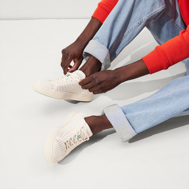 Model wearing The RS02 Sneaker in Courtside White. 