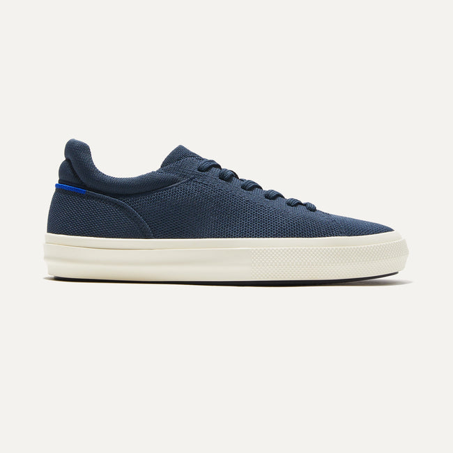 The RS02 Sneaker in Navy shown from the side.