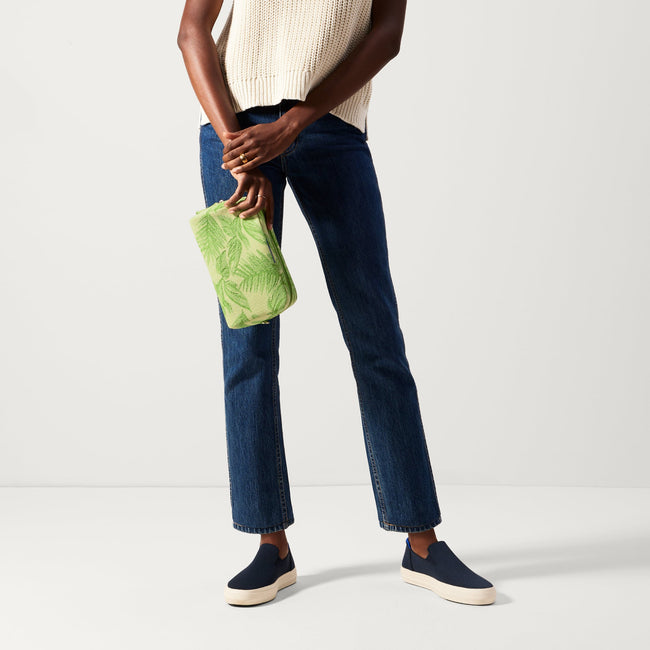 The Universal Pouch in Palm Leaf held by model in a different view