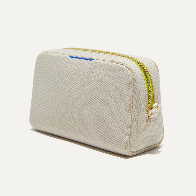 The Mini Universal Pouch in Alabaster shown at a diagonal view from the right.