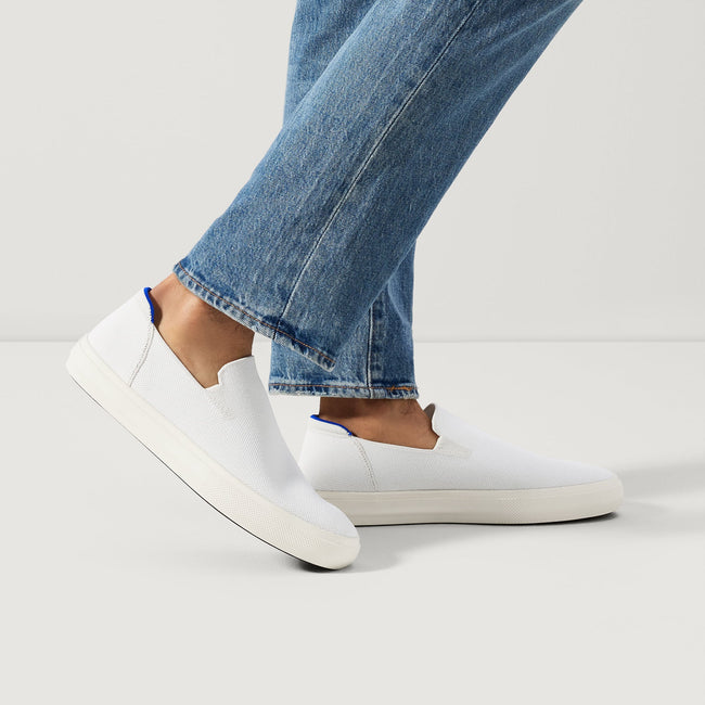 Model wearing The City Slip On Sneaker in White.