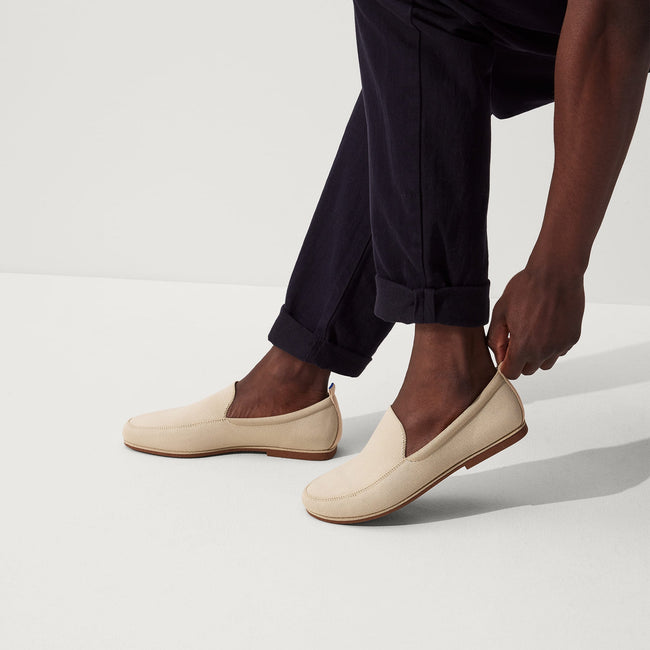 Model wearing The Ravello Loafer in Sand. 
