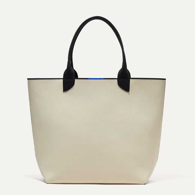 The Reversible Lightweight Tote in mist & Ivory shown from the front. 