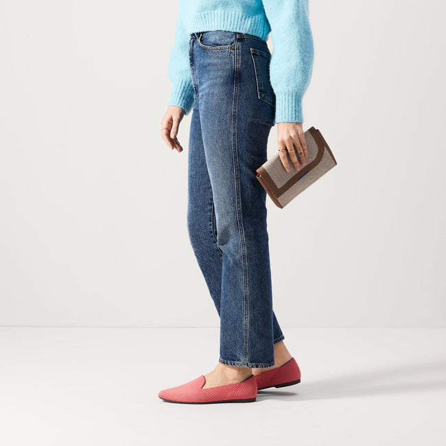 Alternate view of a model wearing The Almond Loafer in Ruby Grapefruit. 