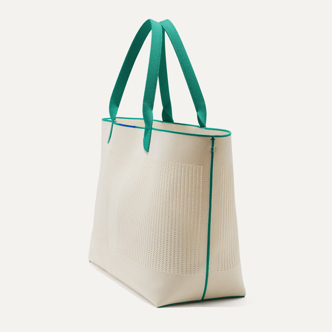 The Lightweight Mega Tote in Courtside White, shown from the side.