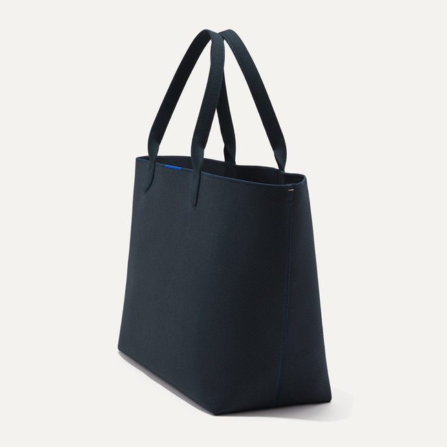 The Lightweight Mega Tote in Navy Twill, shown from the side.