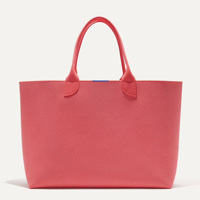 The Lightweight Mega Tote in Ruby Grapefruit Twill, shown from the from the front. 