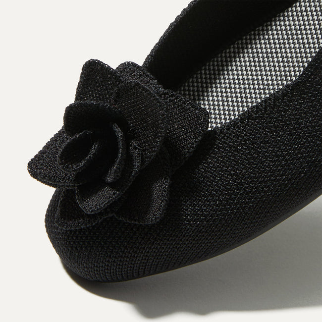 Close up of the square-shaped toe and rounded vamp of The Petal Square in Black. 
