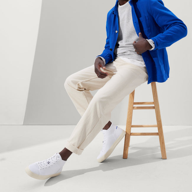 Alternate view of a model wearing The High Top Sneaker in Bright White. 