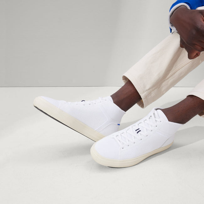 Model wearing The High Top Sneaker in Bright White.